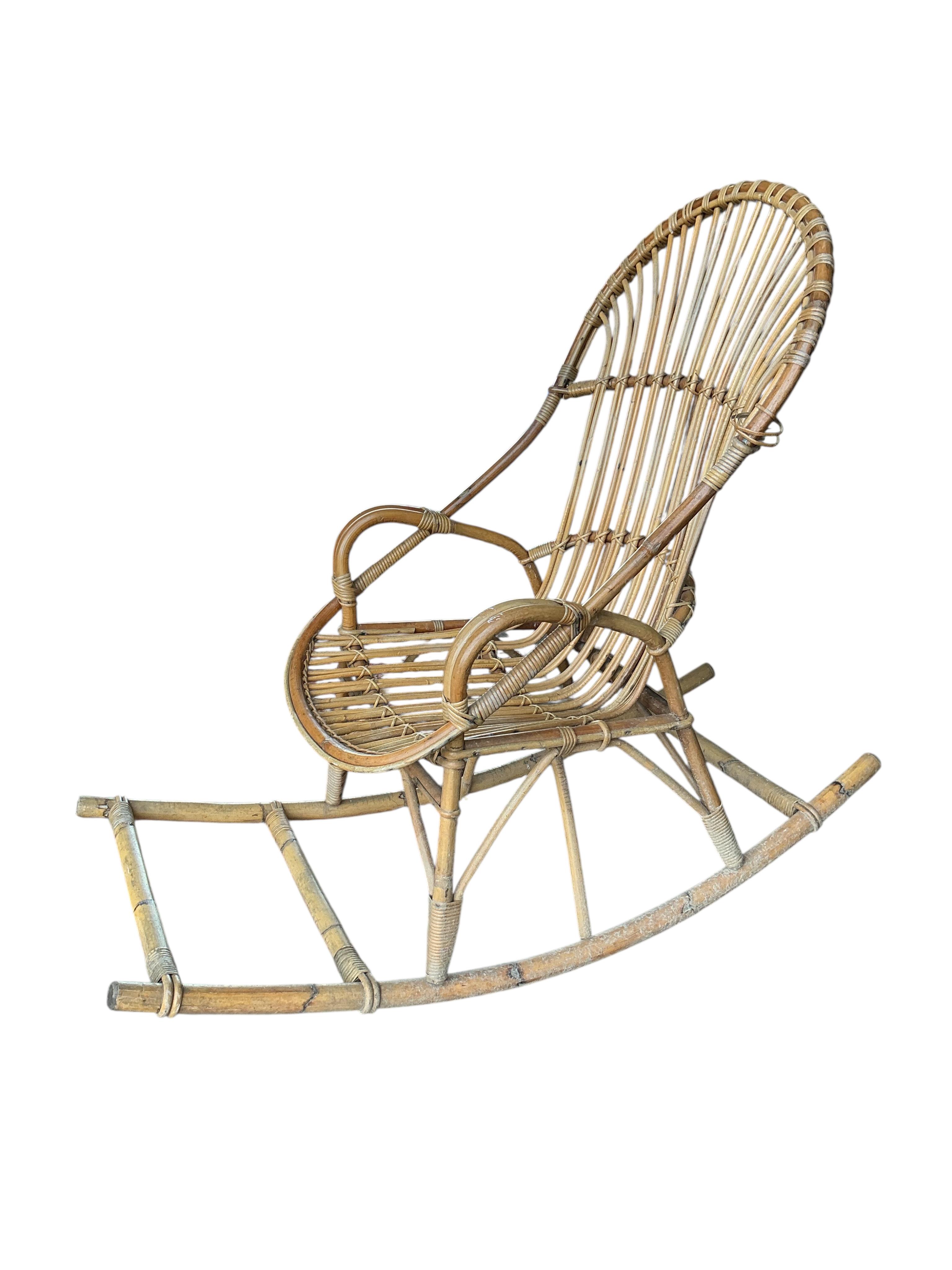 A vintage bamboo rocking chair, width 58cm, depth 125cm, height 100cm